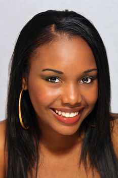 A close-up of a lovely young Haitian girl with a captivating smile.