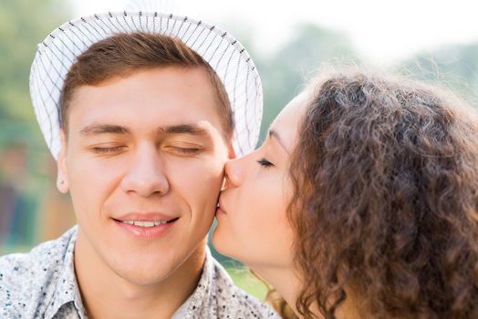 girl kissing a man on the cheek, spending time with loved ones