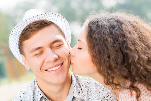 girl kissing a man on the cheek, spending time with loved ones