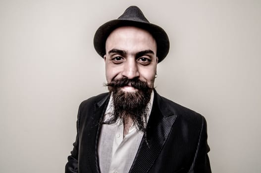 long beard and mustache hipster with elegant suit 