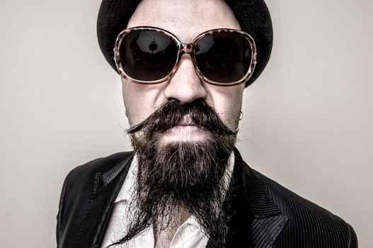 long beard and mustache hipster with elegant suit 