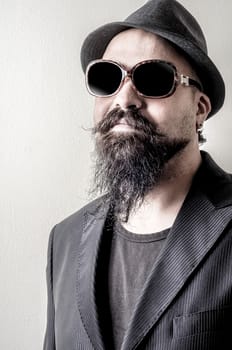long beard and mustache hipster with elegant suit 