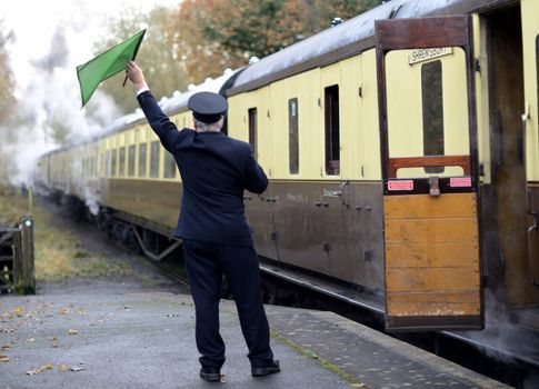 train guard signaling for train to depart