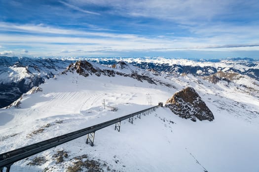 Winter with ski slopes of kaprun resort next to kitzsteinhorn peak in austrian alps