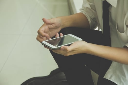 businessman texting and checking his phone