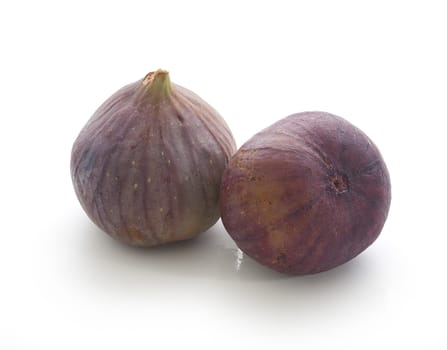Two fresh fig fruit on the white background