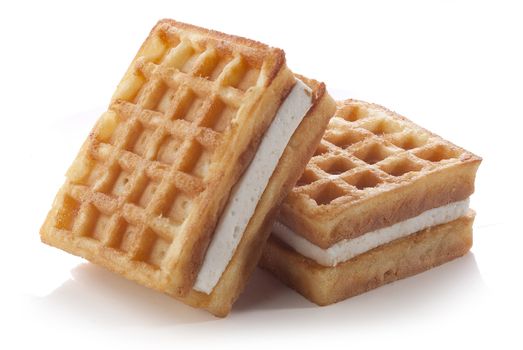 Two waffles with souffle on the white background