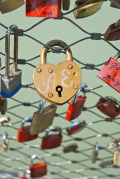 Love lock or love padlock, a padlock which sweethearts locked to a bridge to symbolize their love