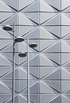 Street lights on futuristic architectural background. Detail of a modern building.