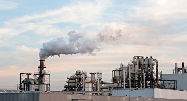 Photo of a cellulose / paper factory at sunset. Portugal.