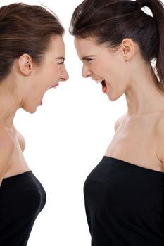 two young girls angry shouting loud isolated on white background