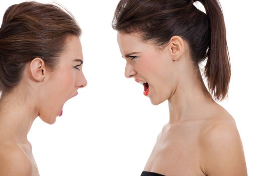 two young girls angry shouting loud isolated on white background