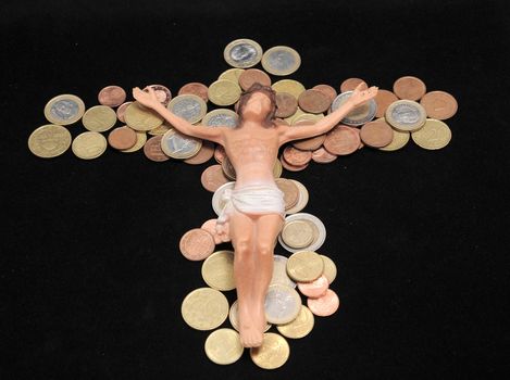 Jesus Christ and Money on a Dark Background - Religion Concept