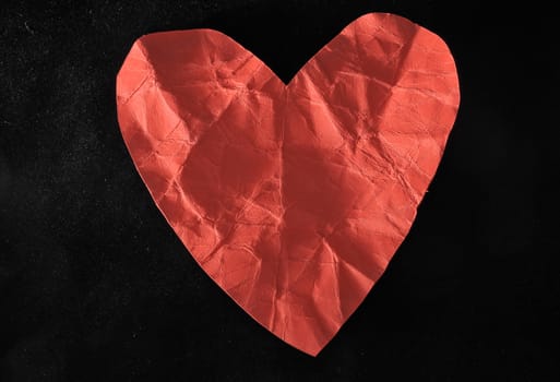 Grunge Red Paper Heart on a Black Background