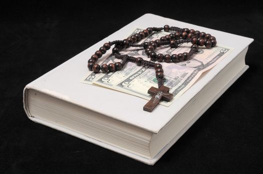 Jesus Christ and Money on a Dark Background - Religion Concept