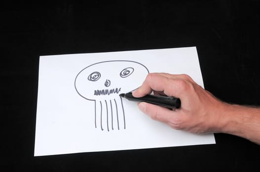 A Caucasian Male Hand Drawing on a White Paper