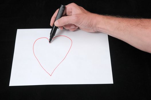 A Caucasian Male Hand Drawing on a White Paper