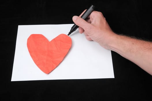 A Caucasian Male Hand Drawing on a White Paper