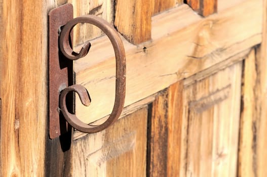 Old Rusty Handle on a Wooden Church Door