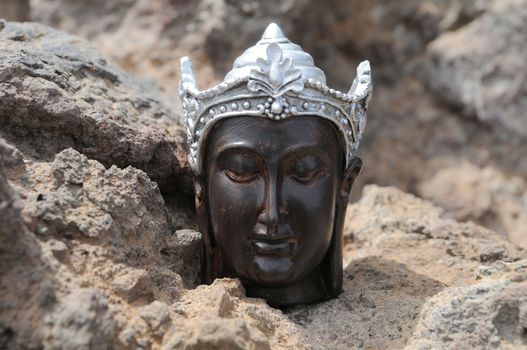 One Ancient Gray Buddha Statue Near The Ocean