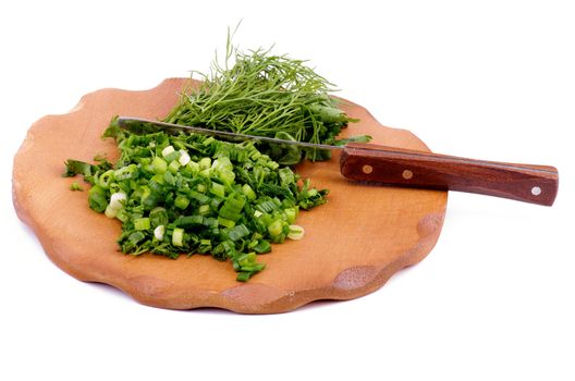 Wooden Cutting Board with Chopped Chives, Parsley, Dill and Table Knife isolated on white background