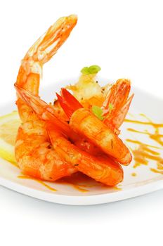 Delicious Fried Shrimps with Lemon and Mustard Sauce on White plate closeup