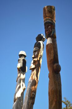 The Three Wooden Dolly Post and Blue Sky