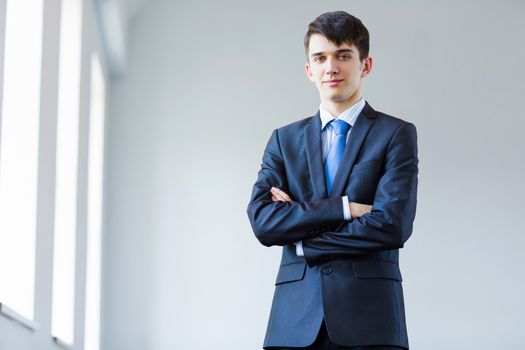 Image of handsome confident businessman in business suit