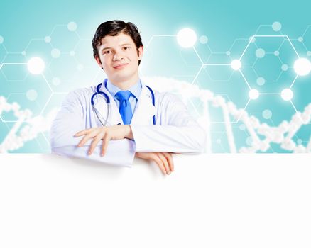 Image of handsome doctor holding white blank banner