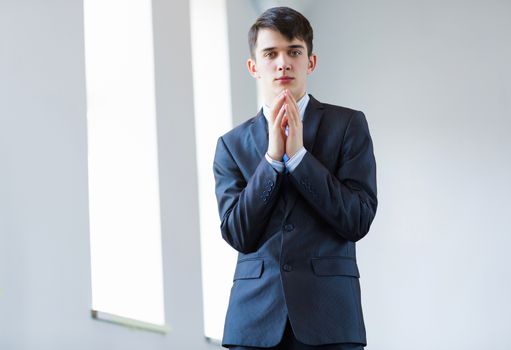 Image of handsome confident businessman in business suit
