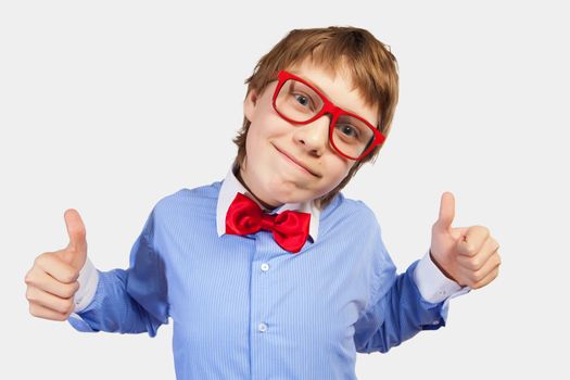 Image of schoolboy smiling showing thumbs up