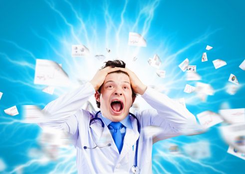 Image of young male doctor screaming in madness