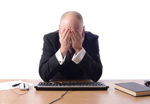 Businessman with head in hands isolated on white, concept of despair