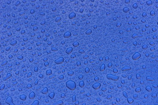 Dark blue metalic paint with water drops short focal range for backgrounds