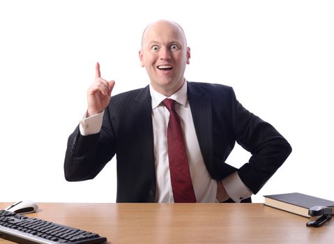 businessman sat at desk with a great idea or plan, isolated on white background