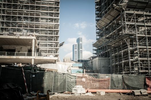 business building between buildings under construction in the city