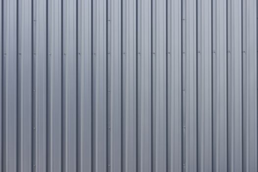 Grey corrugated steel cladding on a industrial building 