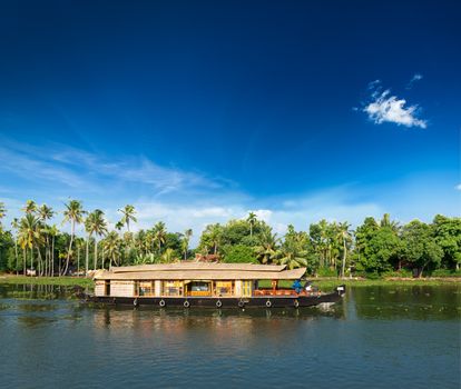 Kerala India travel background - Houseboat on Kerala backwaters. Kerala, India