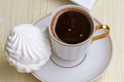 Coffee cup with sweet marshmallow
