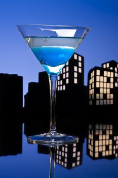 Metropolis Blue Martini cocktail in skyline setting