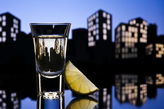 Tequila shoot in colorfull cityscape setting