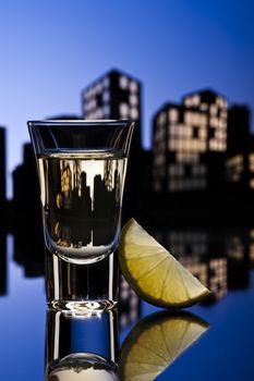 Tequila shoot in colorfull cityscape setting