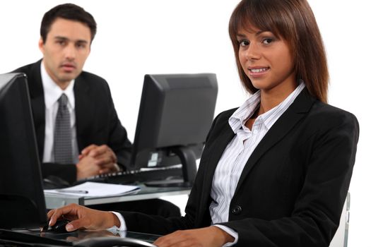 Man and woman taking a break from working to pose for the camera