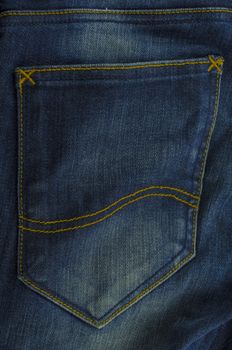 dark jean pocket on blue color background texture