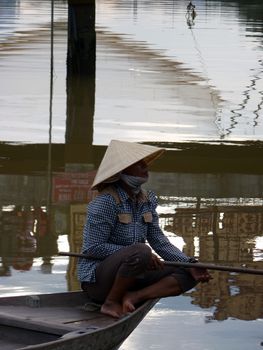 Woman fishing in Hoi An, Vietnam
