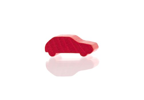Small wooden red car, isolated on white
