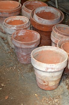 Old clay garden pots stored in shed