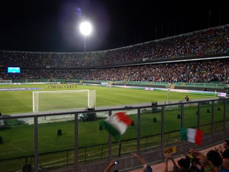 Fans of Italy waving italian flags during the playing of the italian national anthemat the beginning of the  FIFA 2014 World Cup Qualifier group B match between Italy and Bulgaria at Stadio Renzo Barbera on September 6, 2013 in Palermo, Italy.