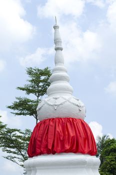 white stppa temple in thailand on sky background