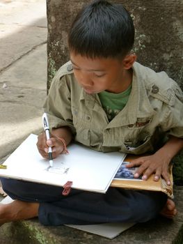 Children drawing in Preah Khan in Siem Reap, Cambodia